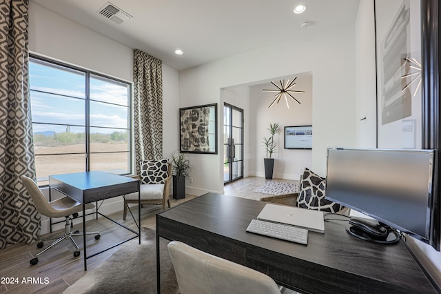 home office featuring light hardwood / wood-style floors