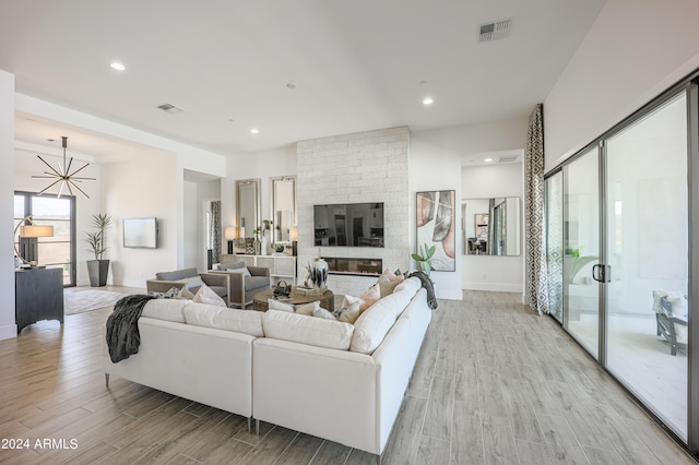 living room with a fireplace and light hardwood / wood-style floors