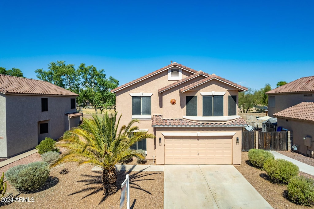 mediterranean / spanish-style home featuring a garage