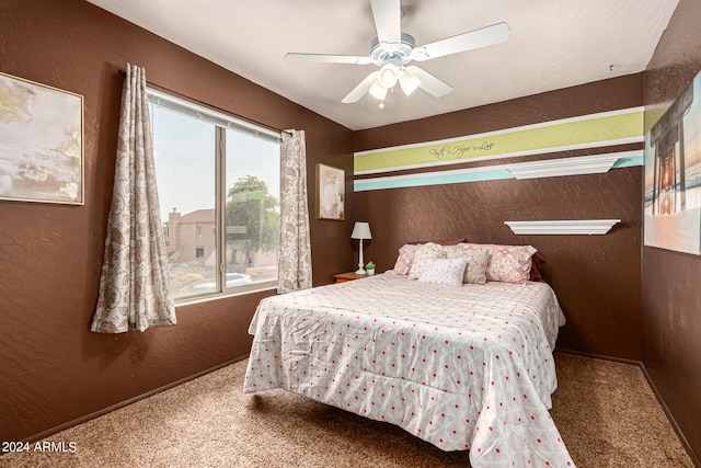 bedroom with ceiling fan and carpet flooring