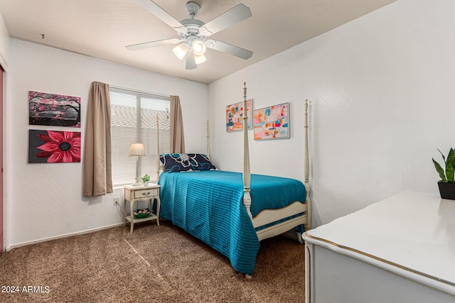 bedroom with ceiling fan and dark colored carpet