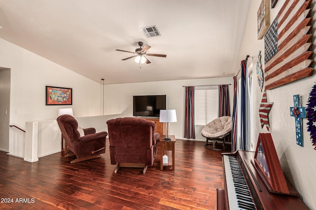 living room with ceiling fan, dark hardwood / wood-style flooring, and lofted ceiling