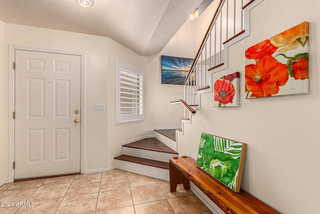 entrance foyer with light tile patterned flooring