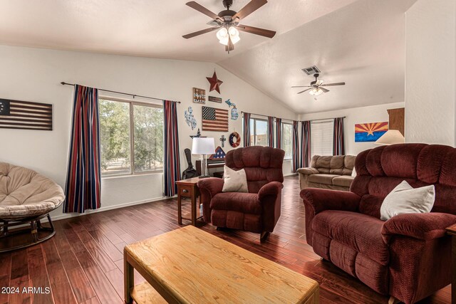 living room with ceiling fan, dark wood-type flooring, and vaulted ceiling