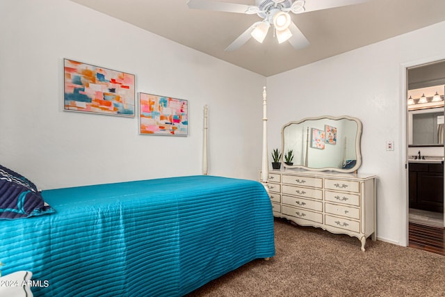 bedroom featuring ceiling fan, ensuite bathroom, and carpet floors