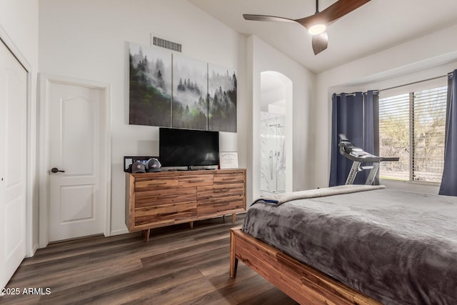 bedroom featuring dark wood-type flooring, ceiling fan, a closet, and vaulted ceiling