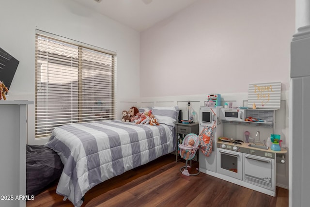 bedroom with dark wood-type flooring and ceiling fan