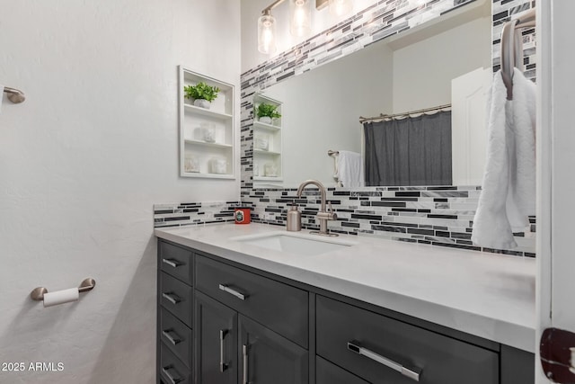 bathroom featuring decorative backsplash and vanity