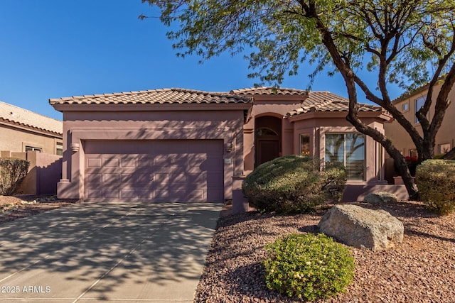 mediterranean / spanish-style home featuring a garage