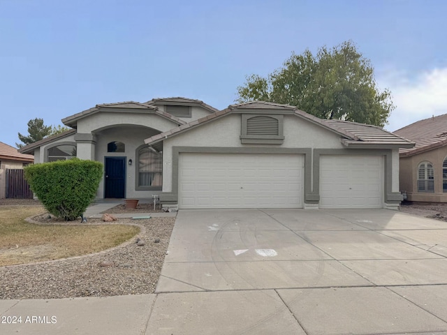 view of front of property with a garage