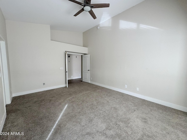 unfurnished bedroom featuring carpet flooring, high vaulted ceiling, and ceiling fan