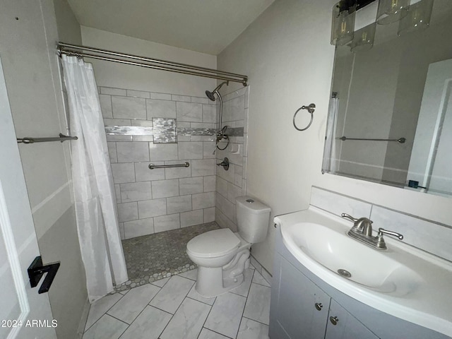 bathroom with a shower with curtain, vanity, and toilet