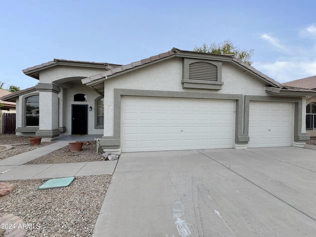 ranch-style house featuring a garage