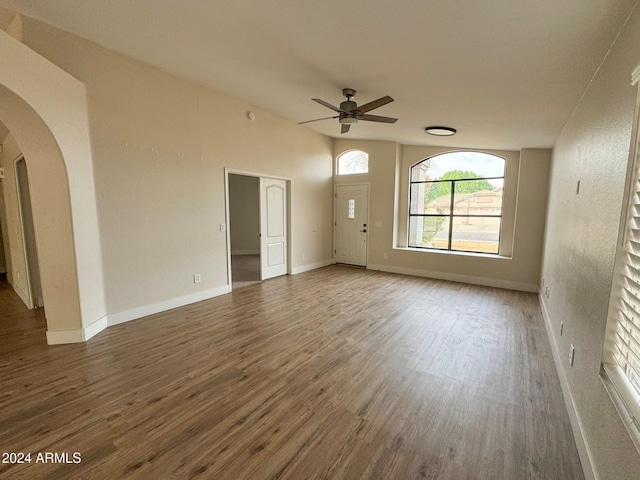 interior space with dark hardwood / wood-style flooring and ceiling fan