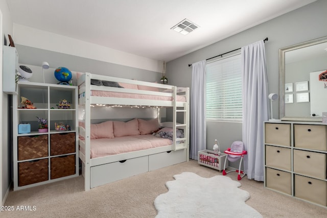 carpeted bedroom with visible vents