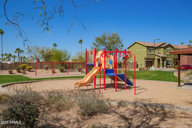 community play area featuring a lawn