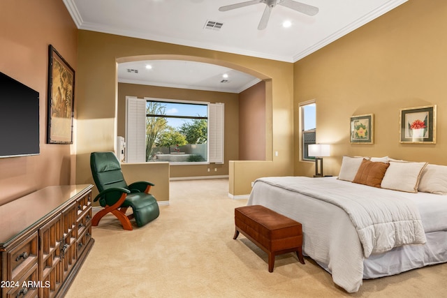 carpeted bedroom featuring ceiling fan and ornamental molding