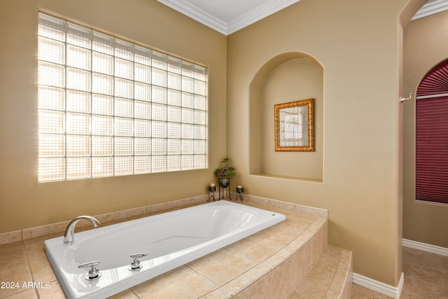 bathroom featuring ornamental molding and a relaxing tiled tub