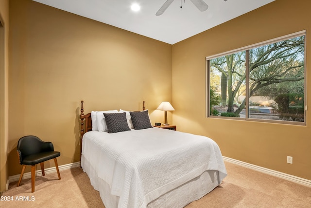 bedroom featuring ceiling fan and light colored carpet