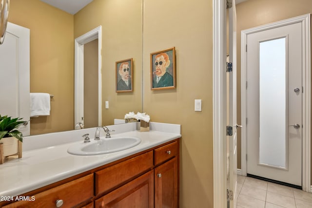 bathroom featuring tile patterned flooring and vanity