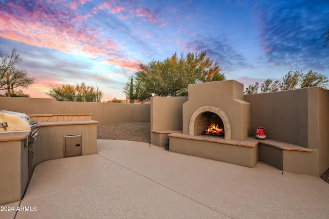 patio terrace at dusk with grilling area