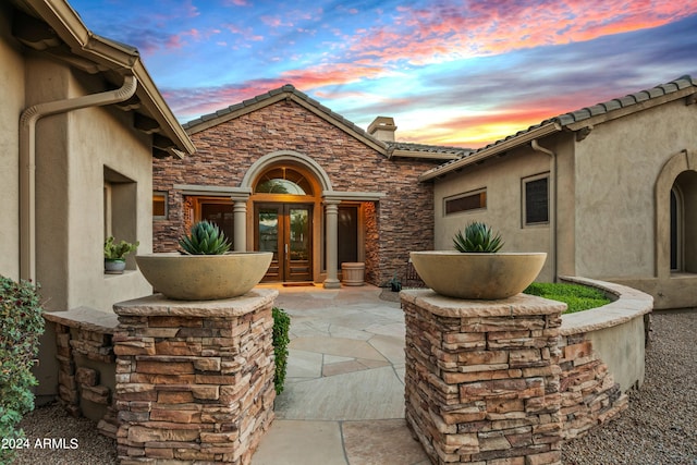 patio terrace at dusk with french doors