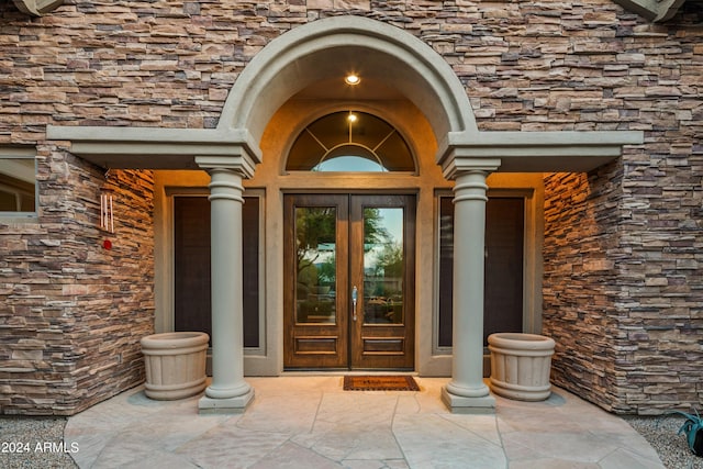 doorway to property featuring french doors