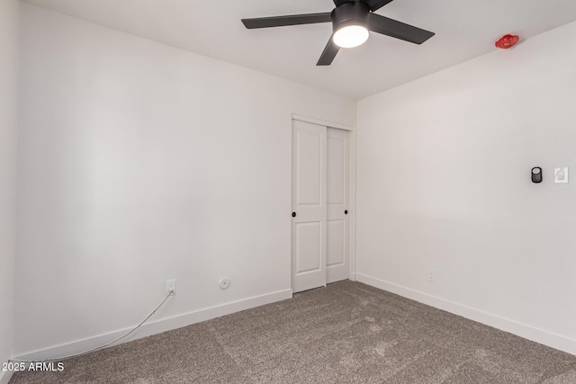 empty room with baseboards, carpet, and ceiling fan