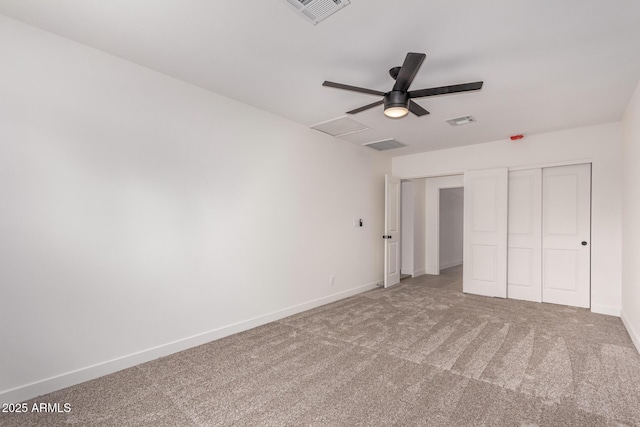 unfurnished bedroom with baseboards, visible vents, and carpet floors