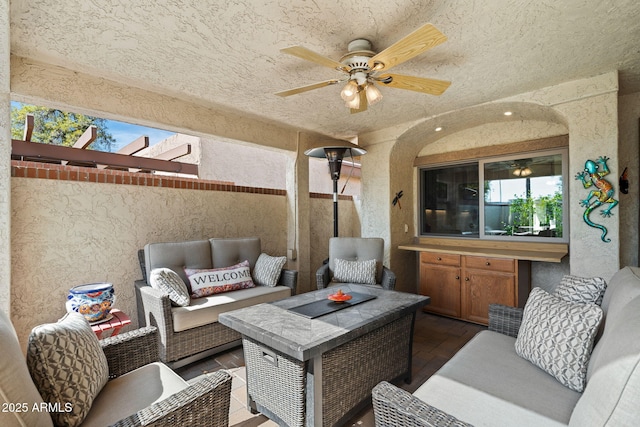 view of patio / terrace with ceiling fan and outdoor lounge area