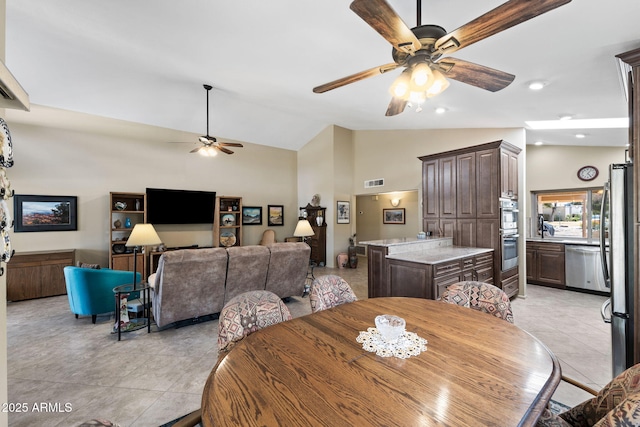 dining area featuring light tile patterned floors, recessed lighting, visible vents, ceiling fan, and high vaulted ceiling