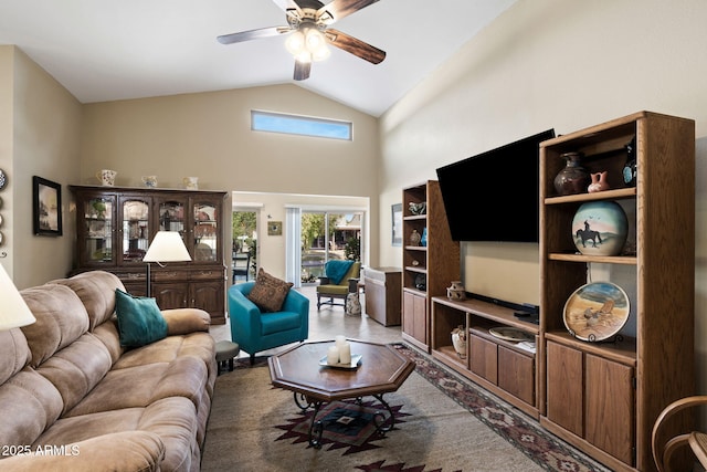 living room featuring a ceiling fan and high vaulted ceiling