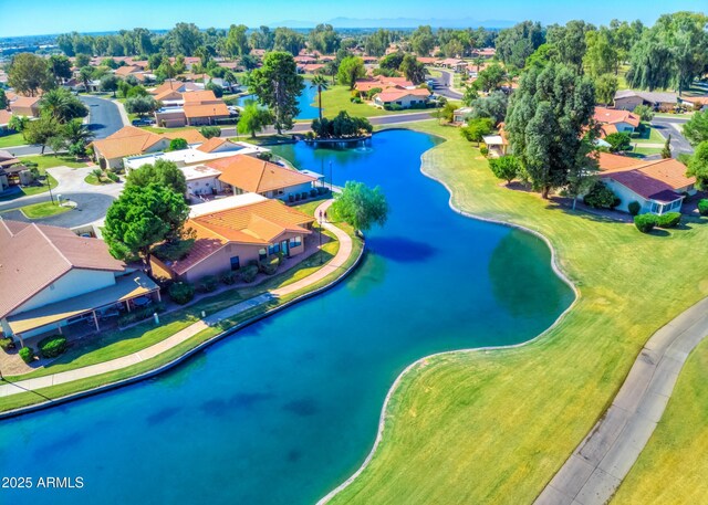drone / aerial view featuring a residential view and a water view