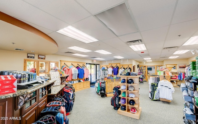 gym featuring a paneled ceiling, carpet, and visible vents