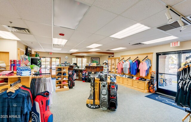 interior space featuring carpet, visible vents, a drop ceiling, and french doors