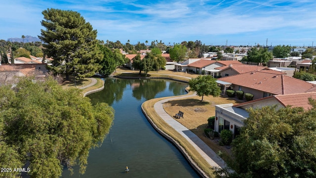 drone / aerial view featuring a residential view and a water view