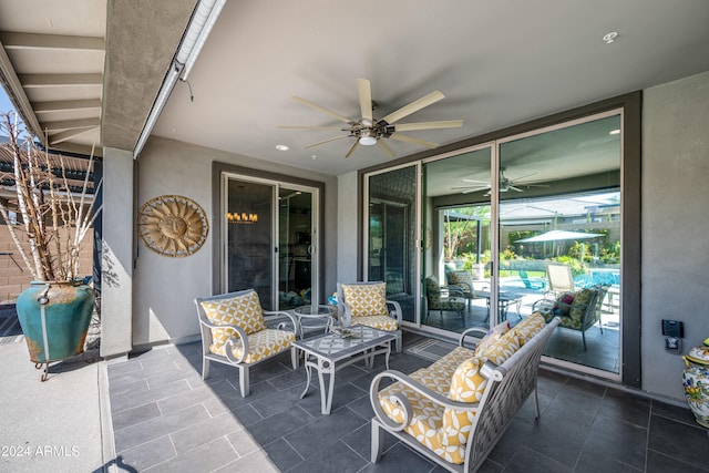 view of patio / terrace featuring ceiling fan and an outdoor living space