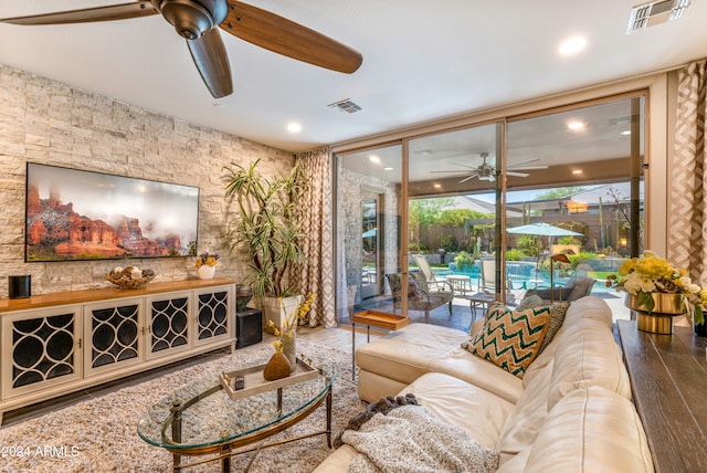 living room featuring hardwood / wood-style floors and ceiling fan