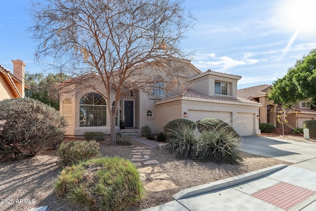 mediterranean / spanish-style home featuring a garage