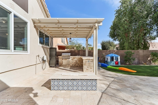 view of patio featuring area for grilling, a pergola, and exterior kitchen