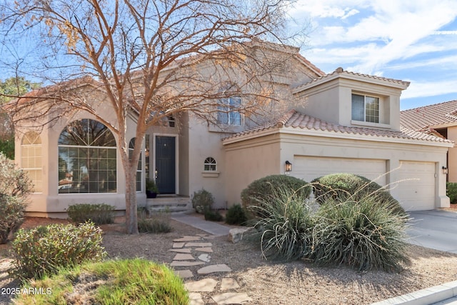 mediterranean / spanish-style house with a garage