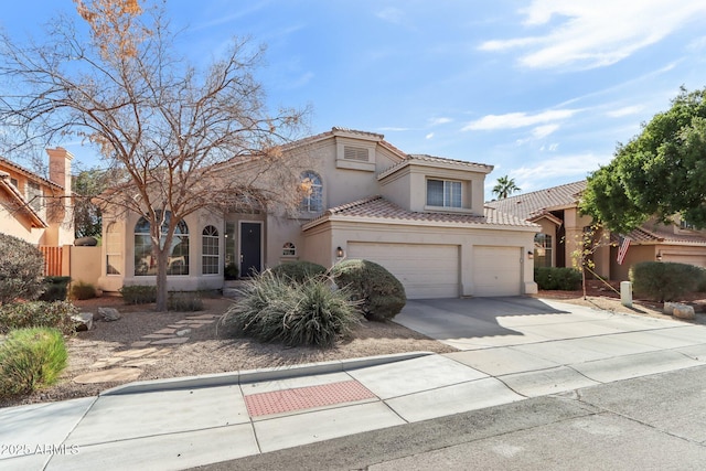 mediterranean / spanish-style home featuring a garage