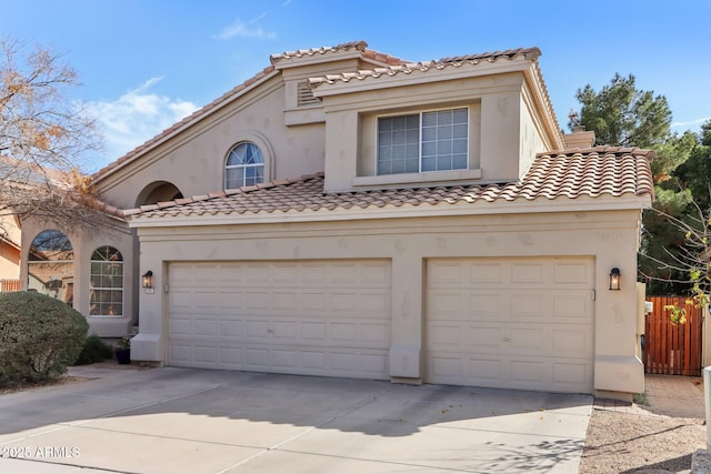 mediterranean / spanish house featuring a garage