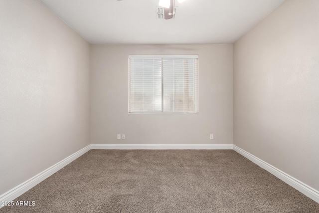 unfurnished room featuring carpet floors and baseboards