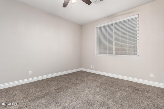 unfurnished room featuring carpet, visible vents, ceiling fan, and baseboards