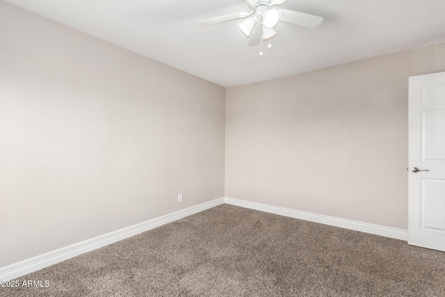 carpeted empty room featuring a ceiling fan and baseboards