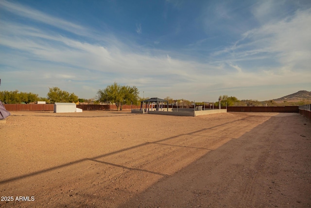 surrounding community featuring fence and a gazebo