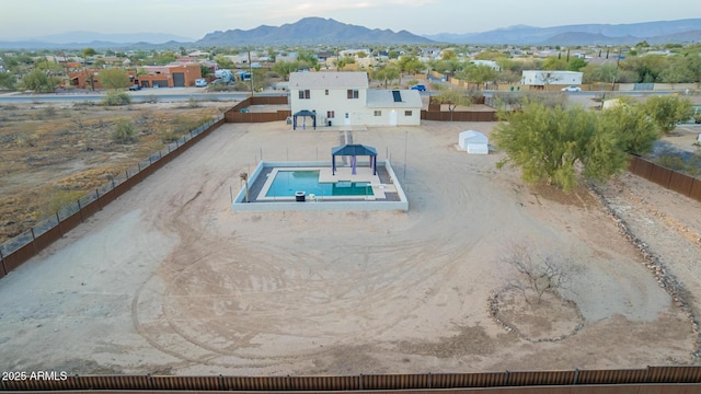 view of pool featuring fence private yard and a mountain view