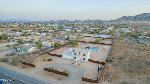 birds eye view of property featuring a mountain view