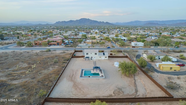 birds eye view of property featuring a mountain view